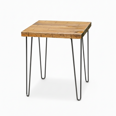Small wooden table with black metal legs on a white background